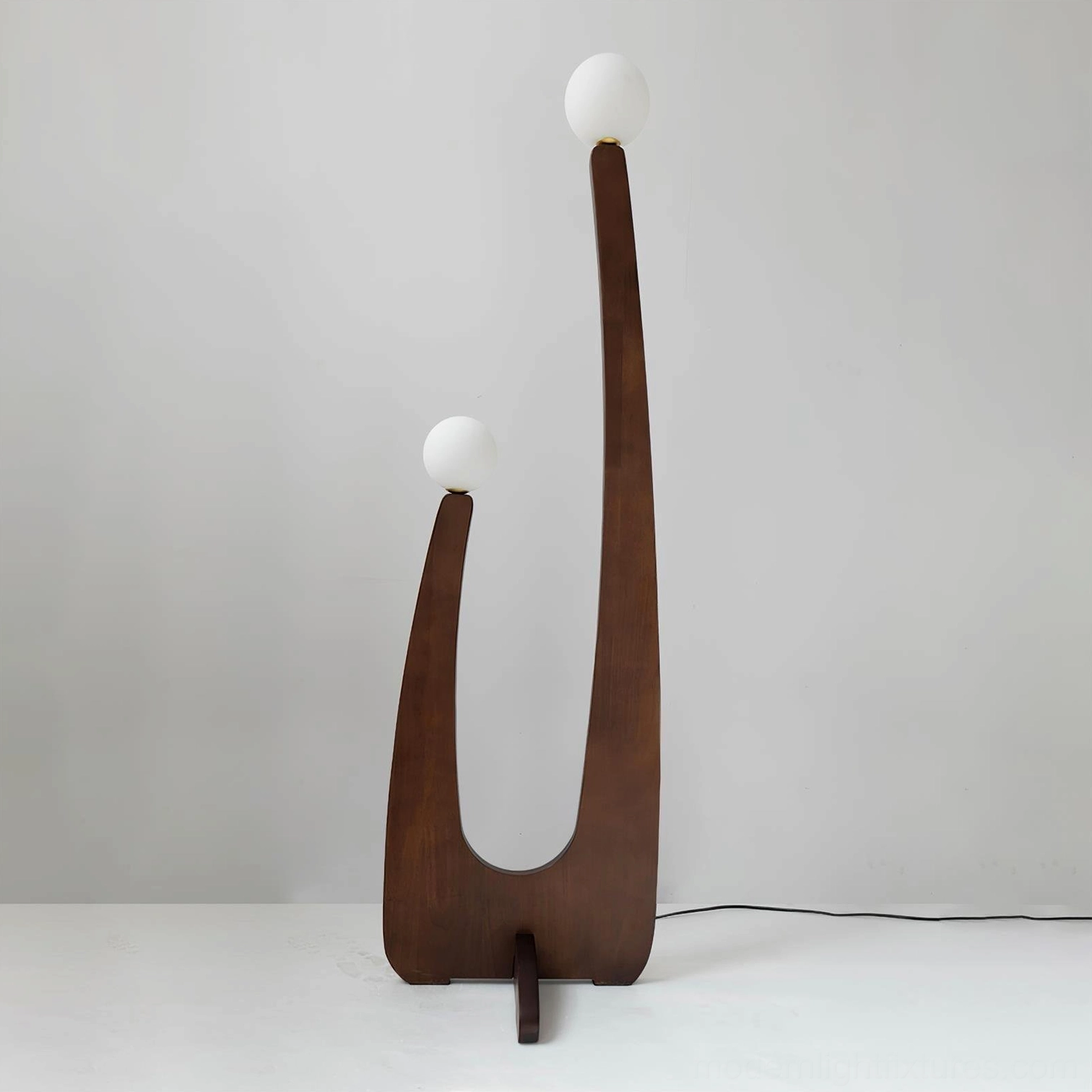 Handcrafted wooden floor lamp with soft frosted diffusion, full silhouette against neutral background