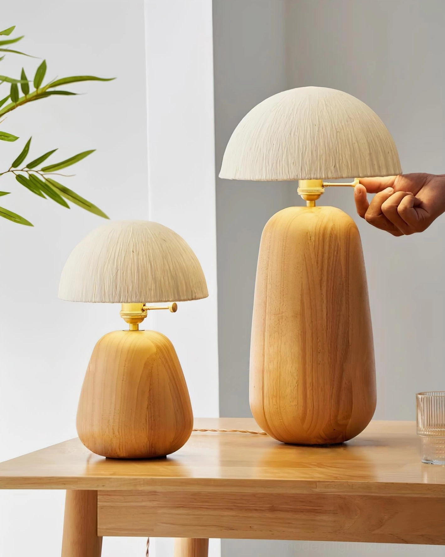 Two size variants of oak wood table lamp showing scale difference in contemporary interior setting
