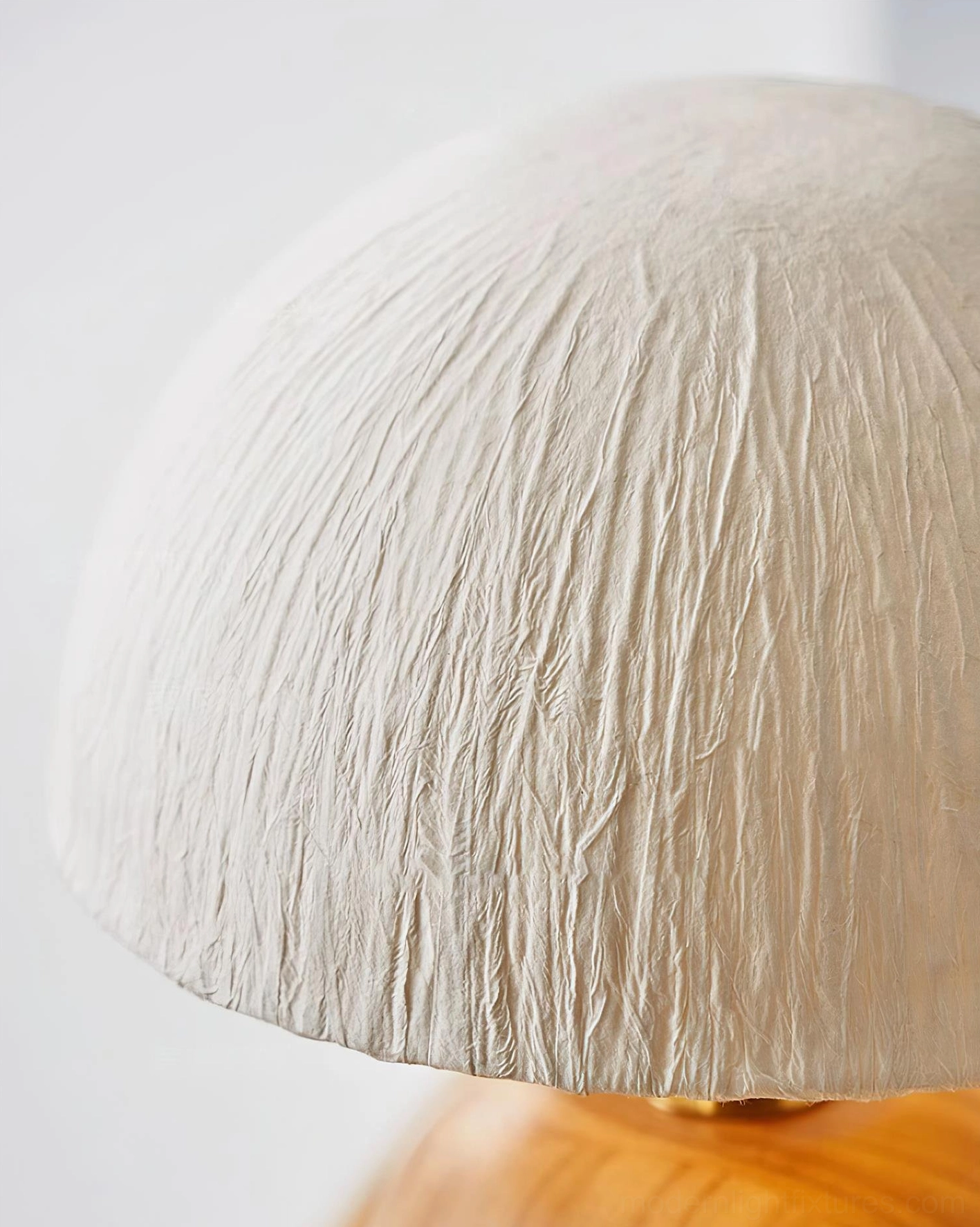 Modern minimalist oak table lamp highlighting natural wood grain texture and metal hardware accents