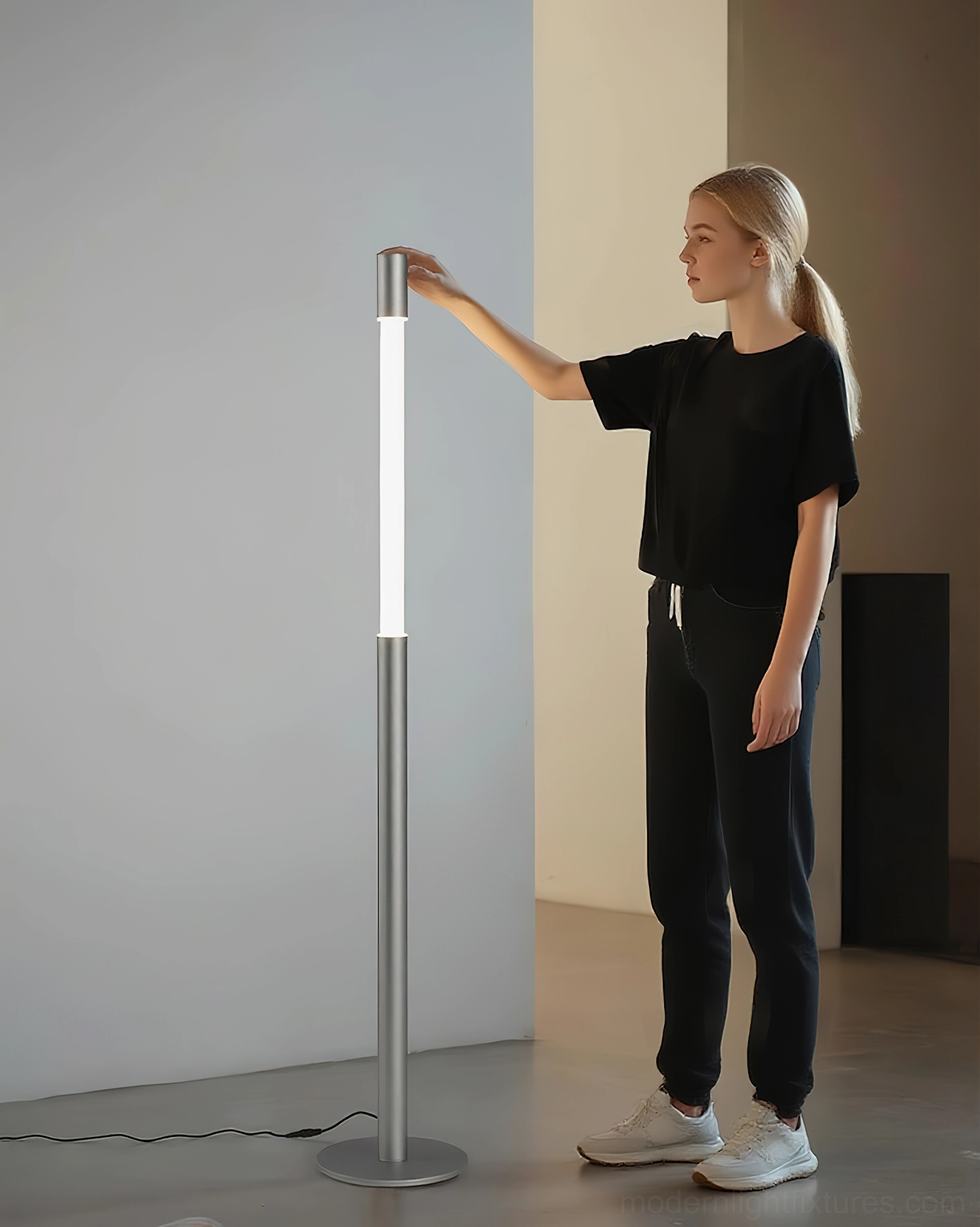 Modern Obelisk floor lamp with touch top switch, three-quarter view in minimalist interior