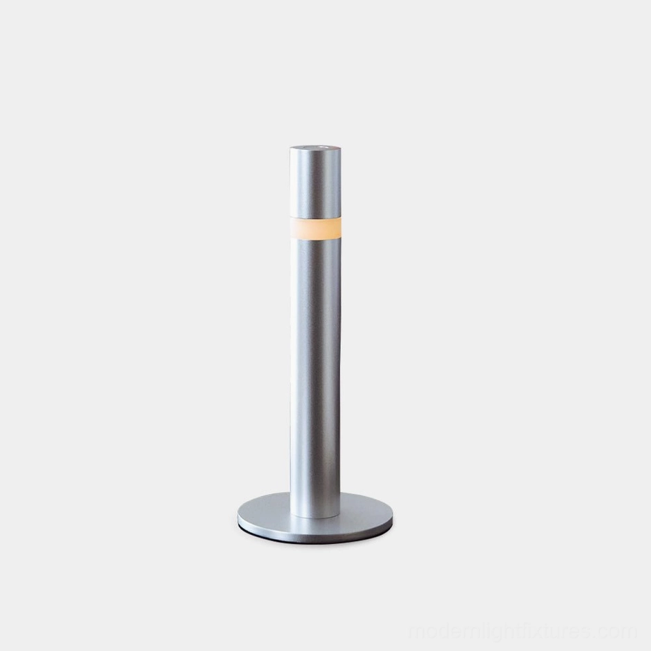 Obelisk modern minimalist table lamp frontal view brushed silver aluminum cylinder design
