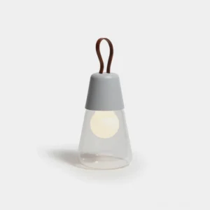 Oceana portable table lamp front view with brown leather handle and light gray matte top, minimalist modern design on white background