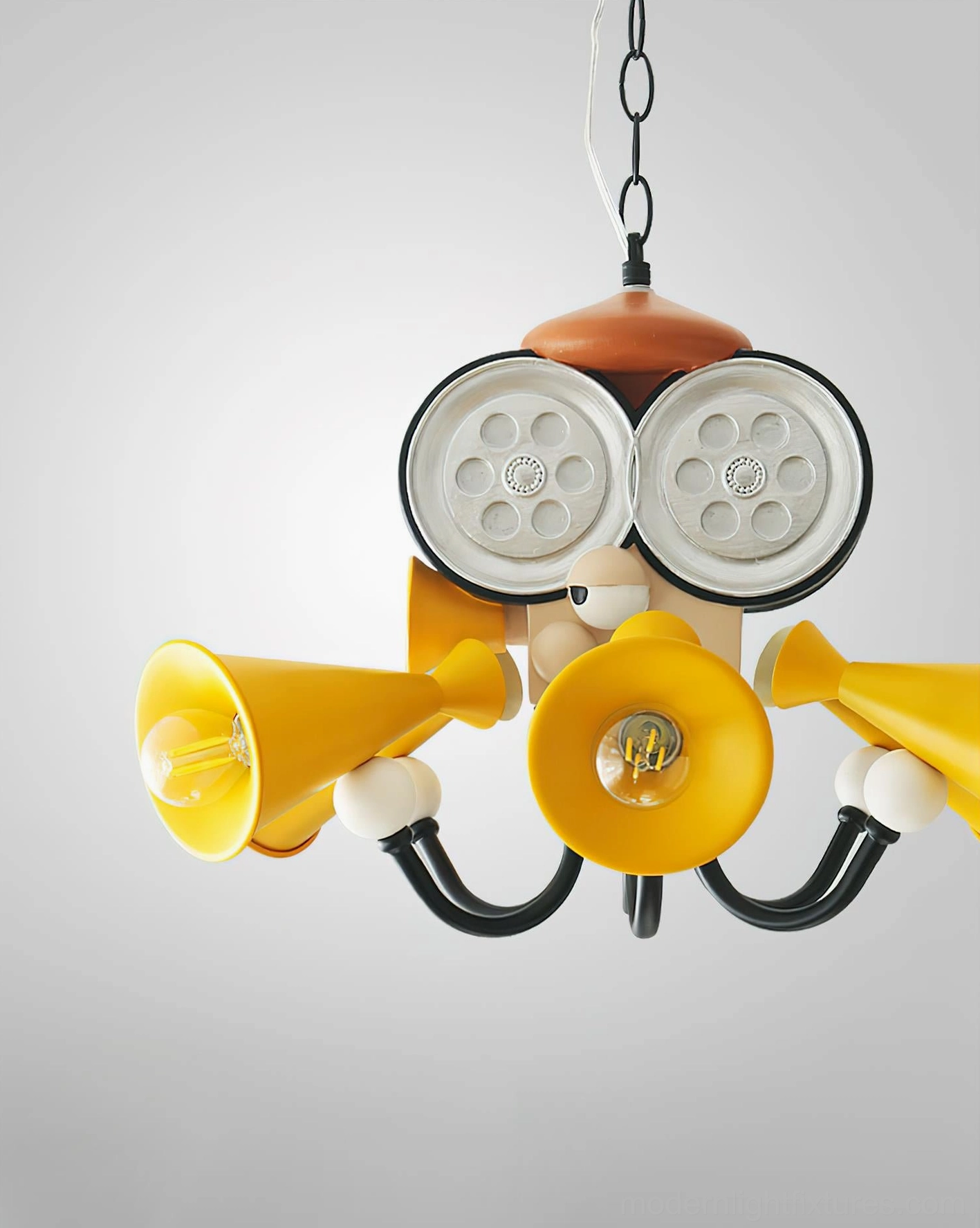 Octopus director chandelier oblique close-up view displaying clear lamp structure and central yellow bulb illumination