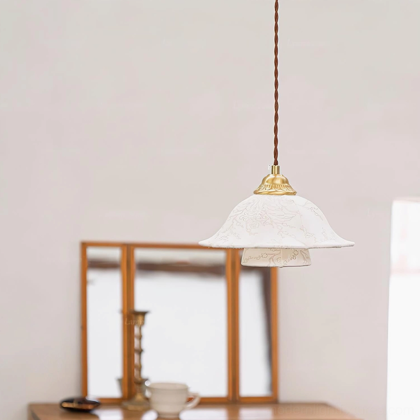 Off-white embossed fabric pendant with twisted brown cord from rear vanity area view