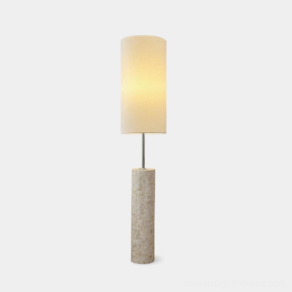 Ollie modern floor lamp with textured glass base and white cylindrical fabric shade - studio front view