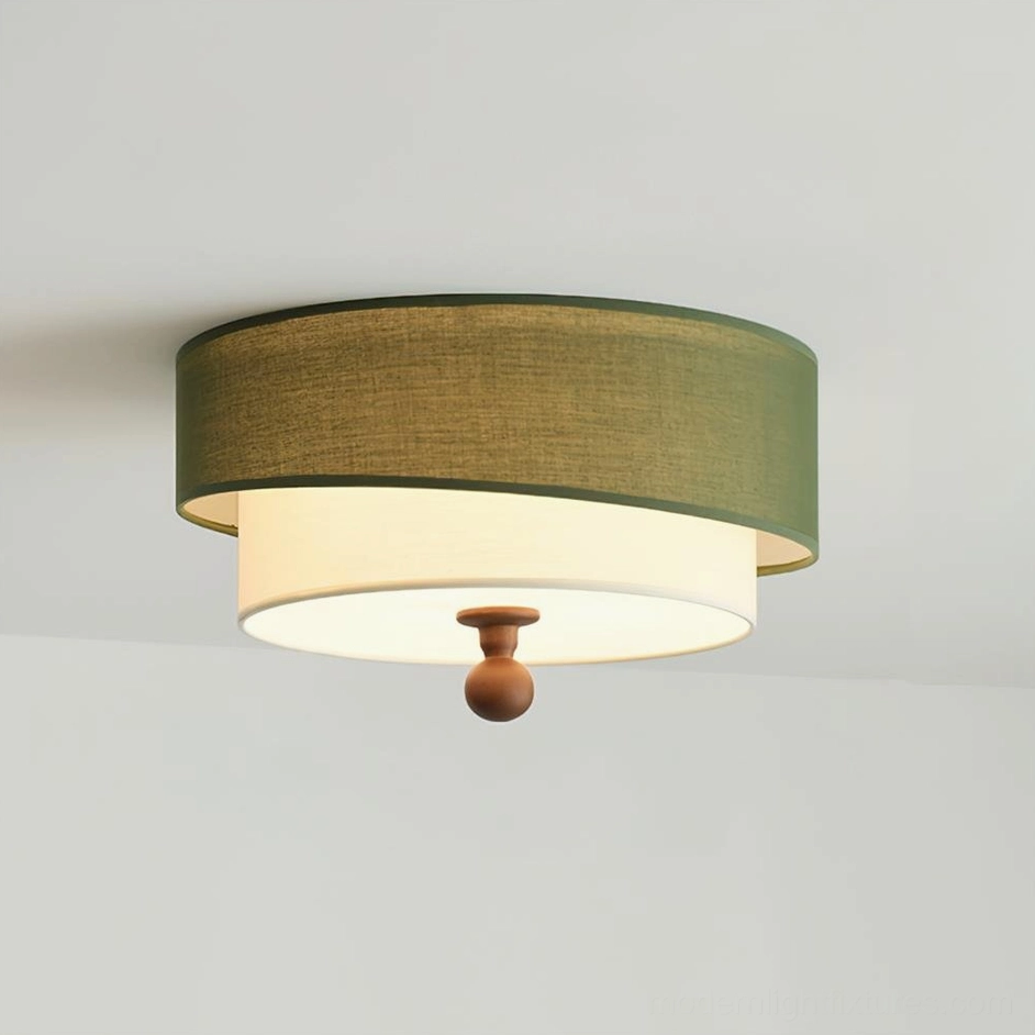 Olten flush mount ceiling light fixture - front static view with dark green fabric and white inner shade on studio background
