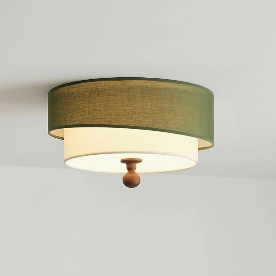 Olten fabric ceiling lamp close-up - olive green outer shade with white inner layer and wooden bottom finial detail