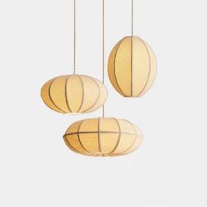 Three Omra modern fabric pendant lights in beige linen with segmented design, overhead studio view on white background, minimalist lantern style fixtures