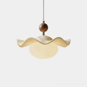 Ondelle wavy resin pendant light close-up studio view with ruffled petal shade and glass globe diffuser