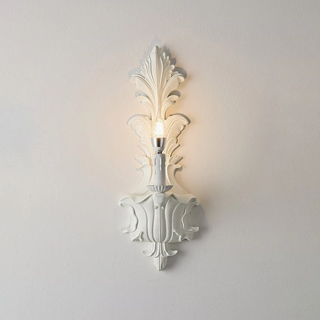 One-light carved acanthus wall sconce in matte white, compact size for hallways and powder rooms
