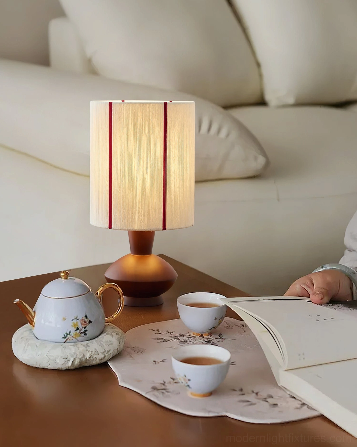 Onslow table lamp in cozy home scene with tea set and reading book, relaxation space lighting