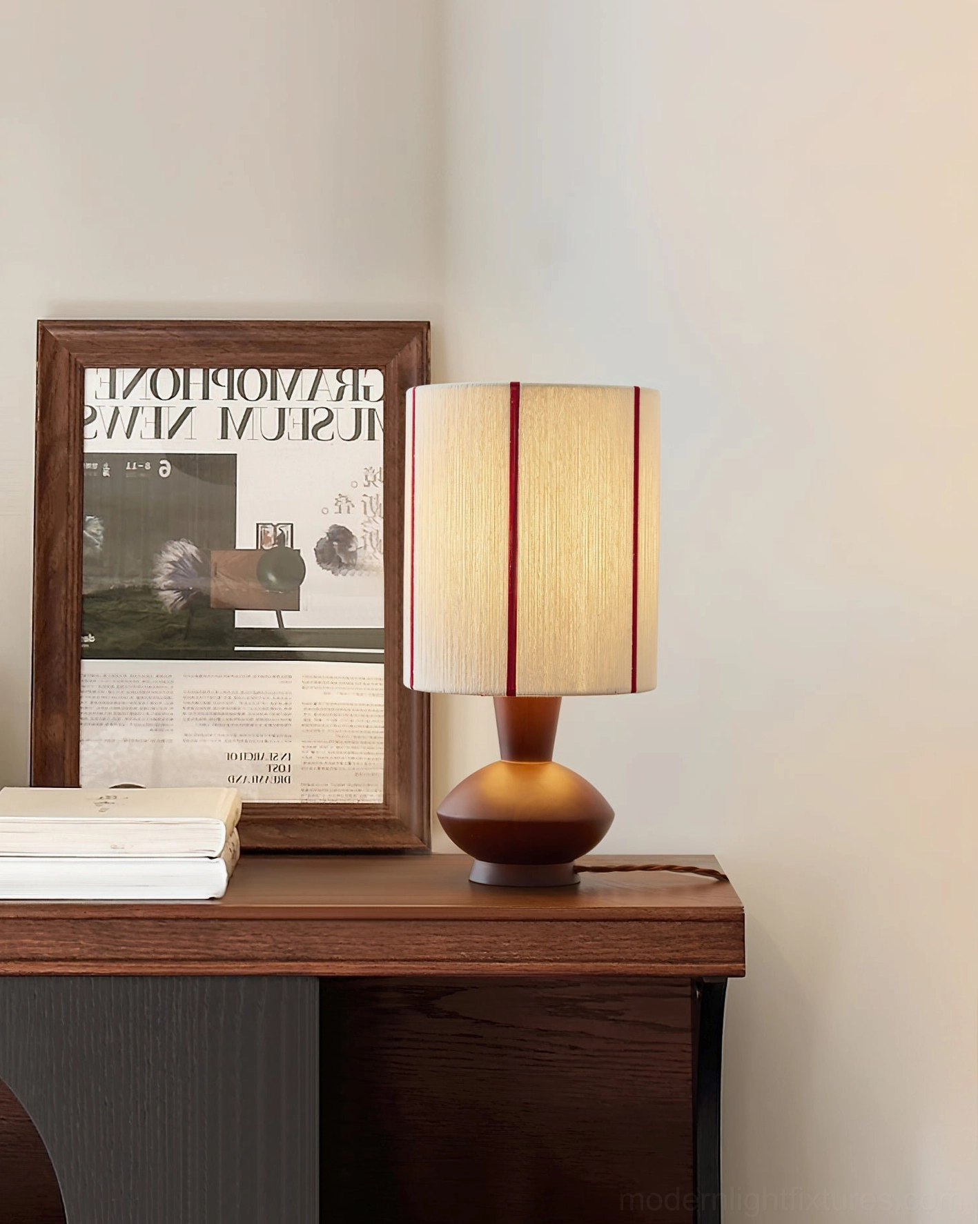 Onslow accent lamp styled on desk with artwork and books, minimal workspace lighting