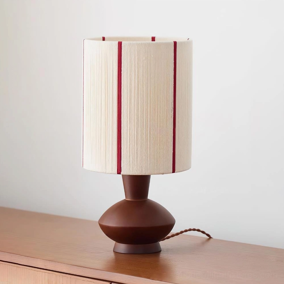 Onslow table lamp in walnut and white variant, three-quarter perspective view on wooden sideboard