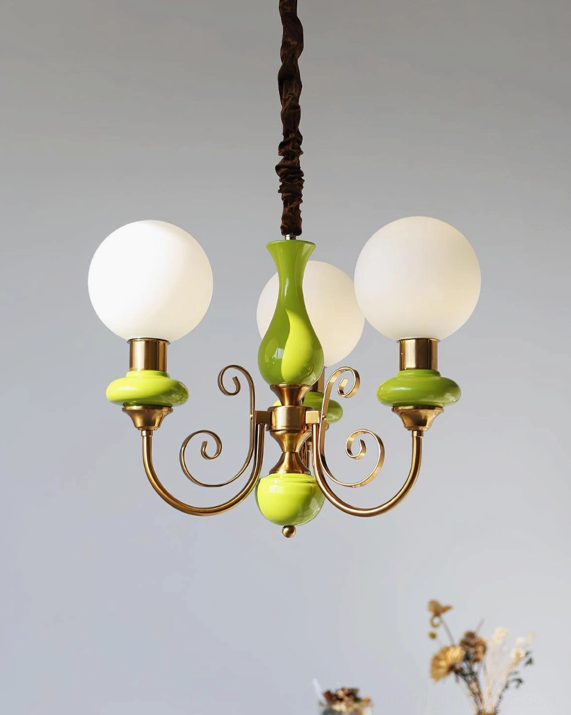 Onyx glass chandelier with warm illumination, vintage-inspired metal frame construction