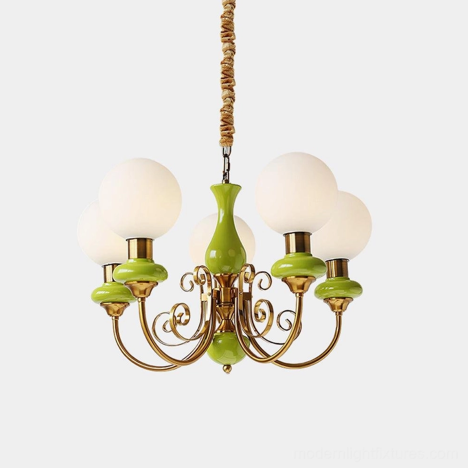 Onyx modern chandelier with frosted glass shades and gold arms, studio front view
