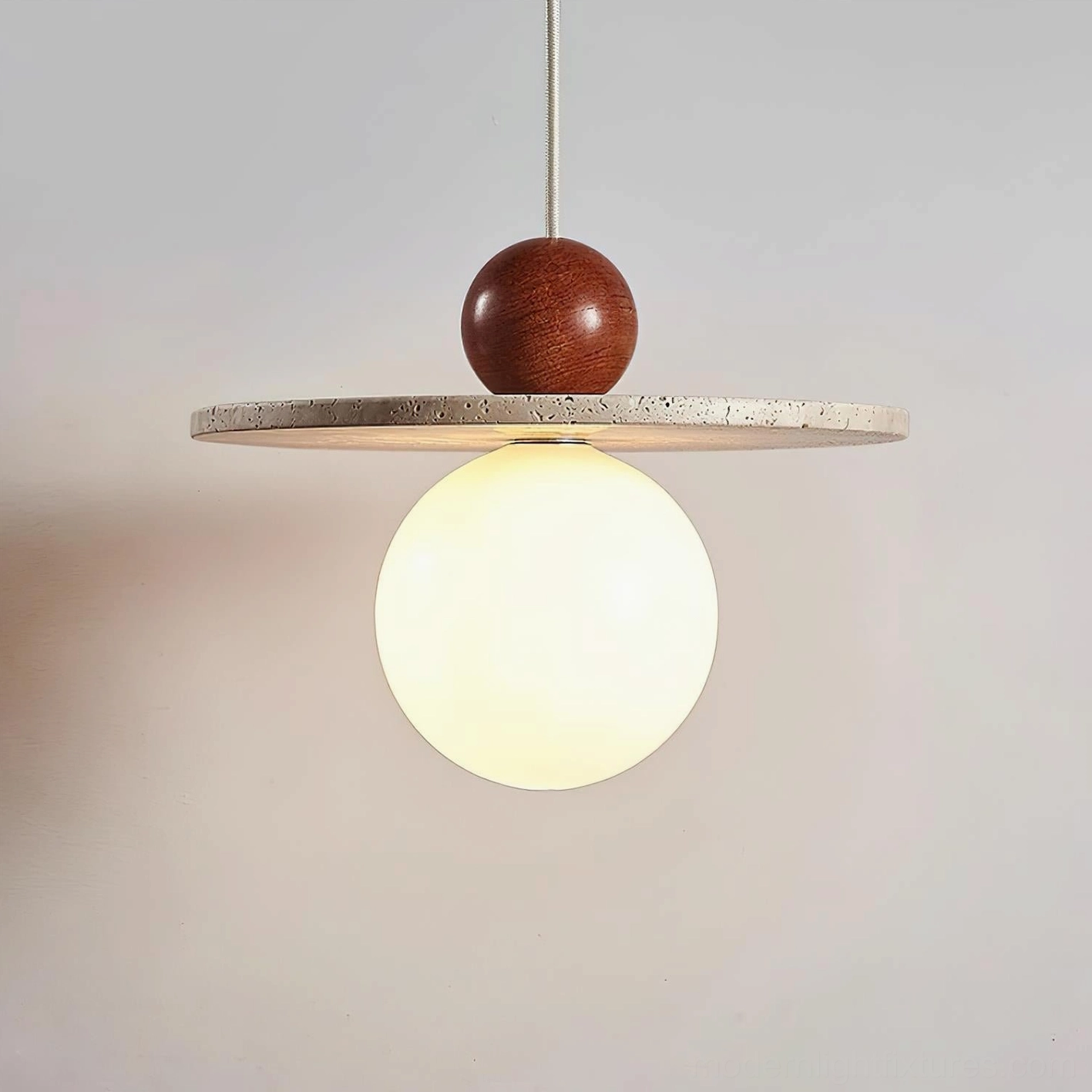 Ora pendant fixture design detail showing wood sphere and glass diffuser assembly