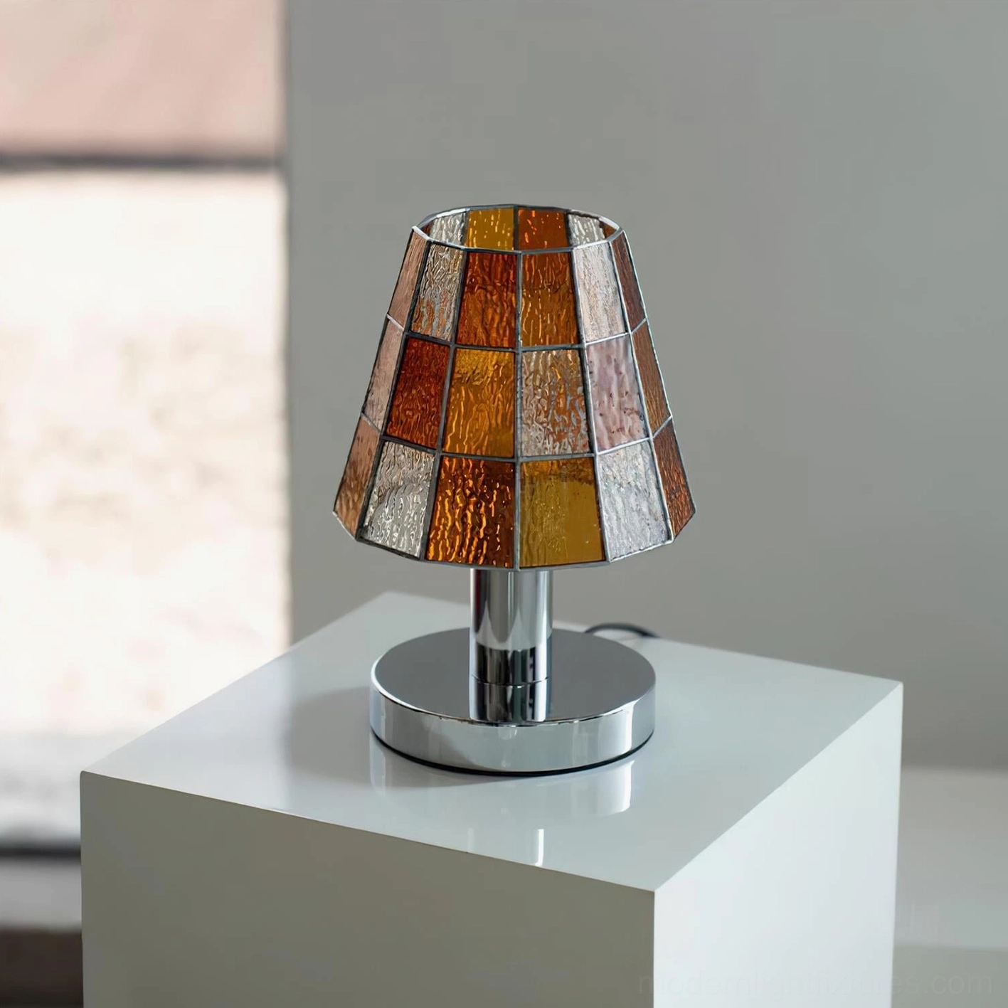 Orange amber stained glass table lamp with chrome base and mosaic glass shade in warm color tone