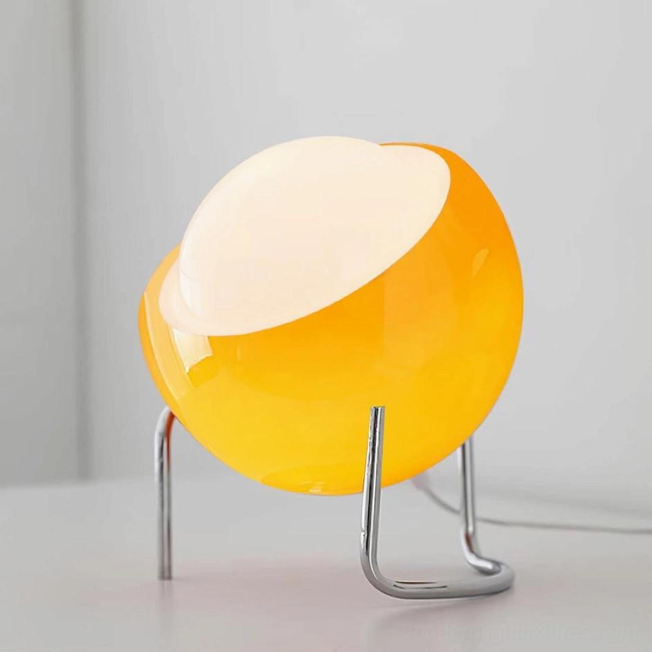 Orange Bauhaus dome table lamp vibrant color variant with tilted sphere shade, mid-century design