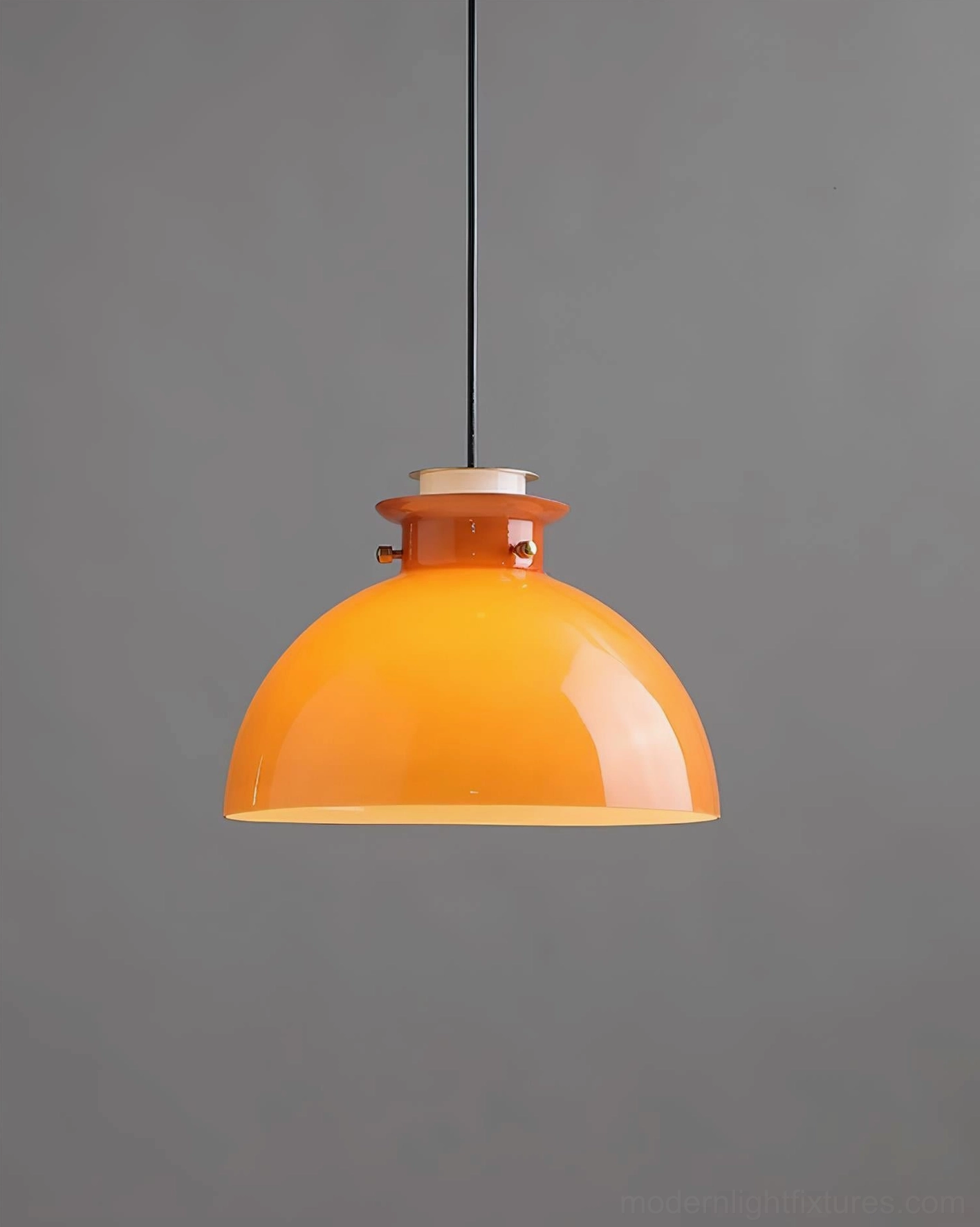 Orange glass dome pendant fixture front side view, contemporary industrial design