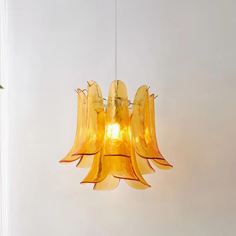 Orange glass petal pendant light creating warm ambient glow in vintage interior