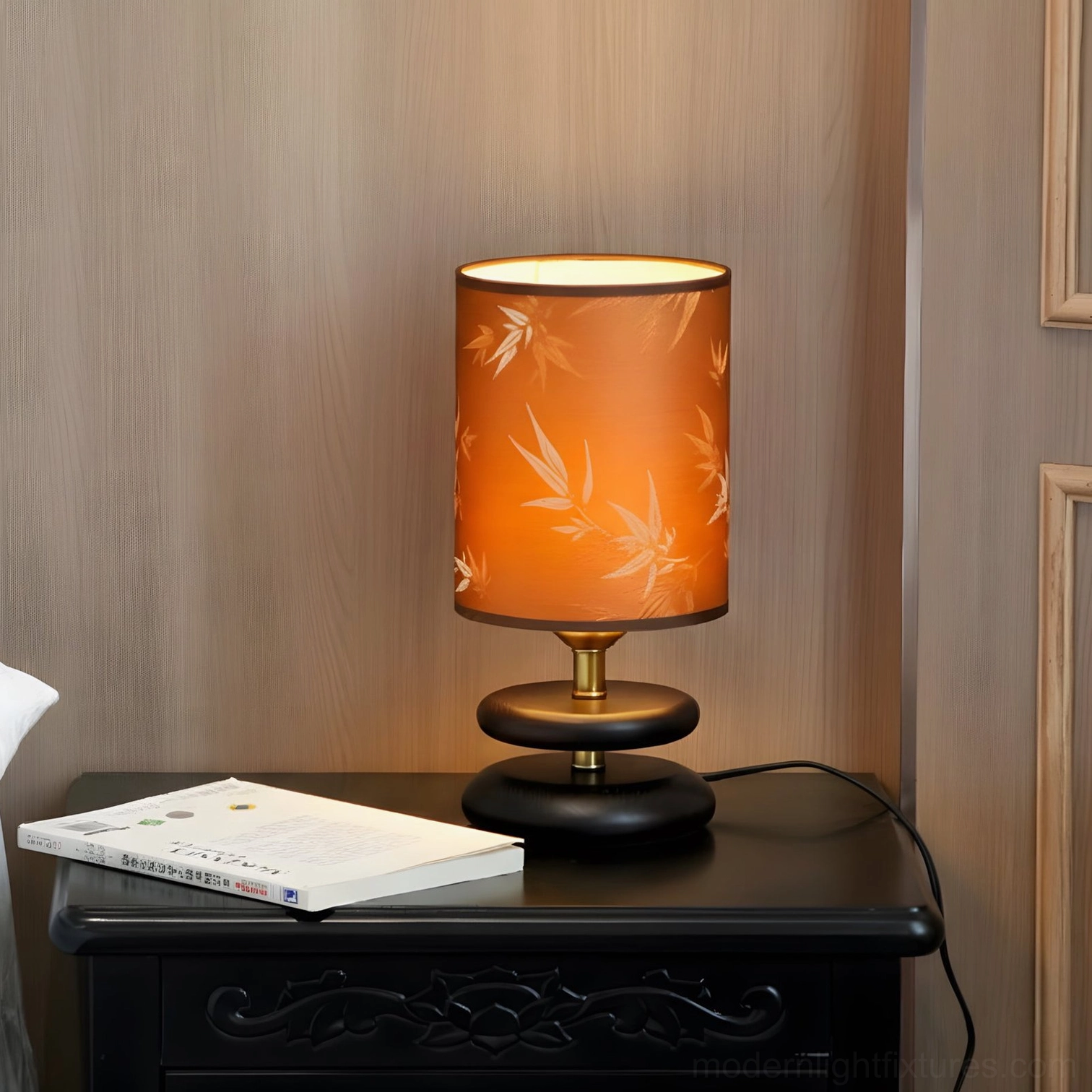 Orange leaf-pattern table lamp on carved wooden nightstand, bedroom minimal style three-quarter front view
