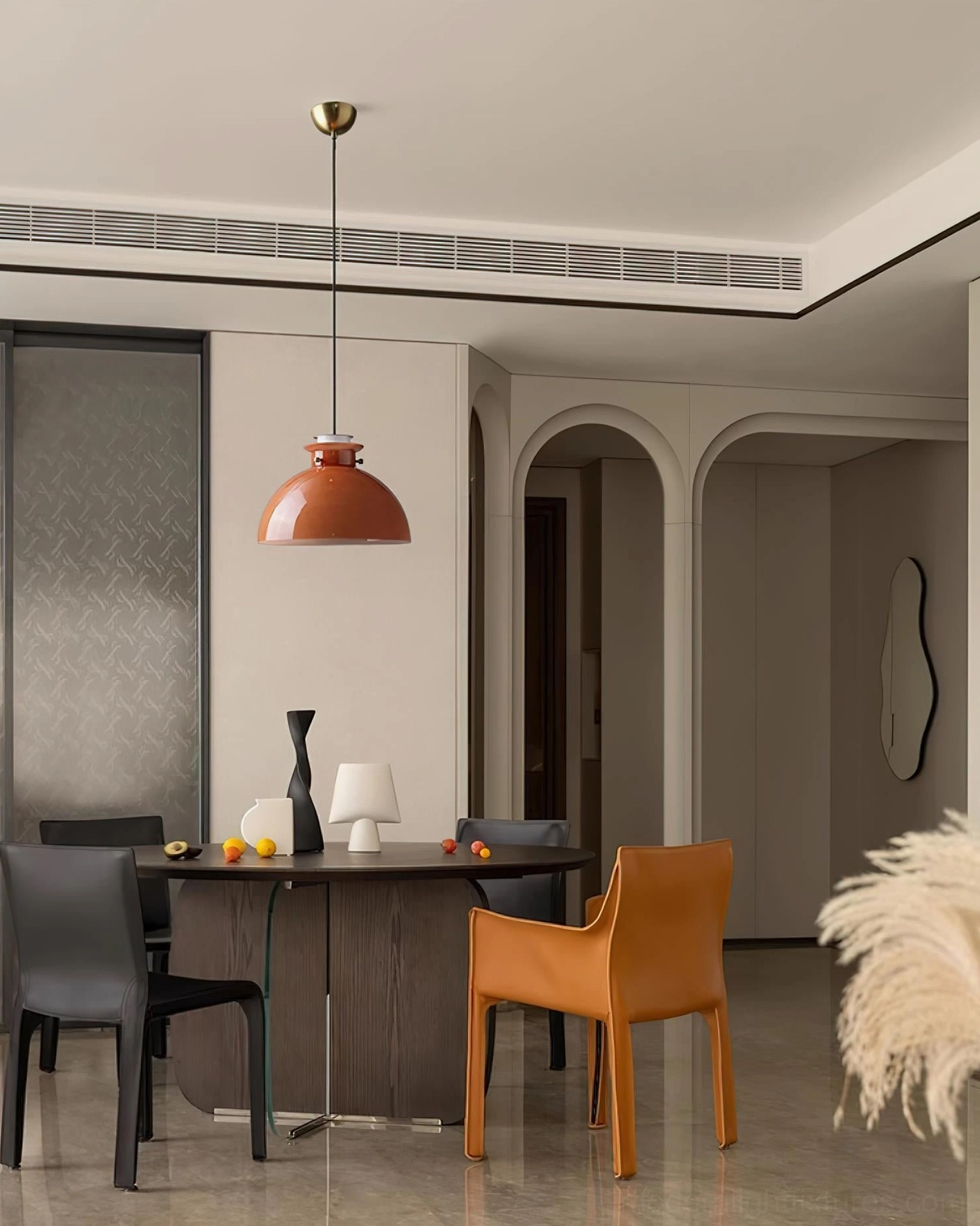 Warm orange glossy glass pendant shade with metal suspension system detail