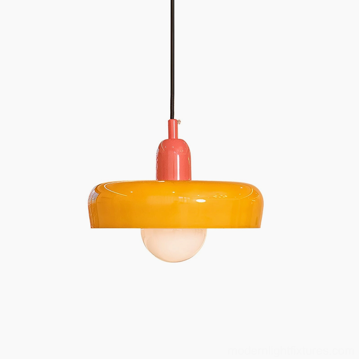 Orange frosted glass donut pendant light studio close-up with pink metal hardware, frontal view highlighting vibrant color and glossy finish