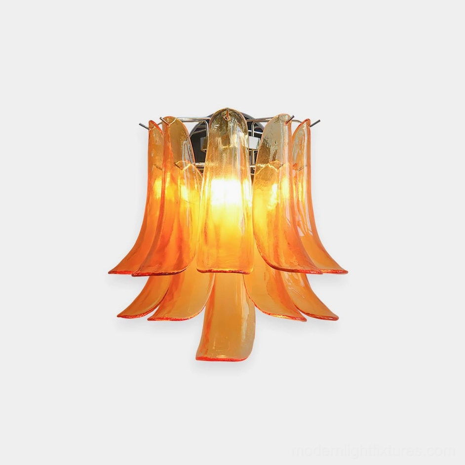 Orange petal glass wall sconce with chrome metal base, frontal studio view showcasing handcrafted glass petal layering