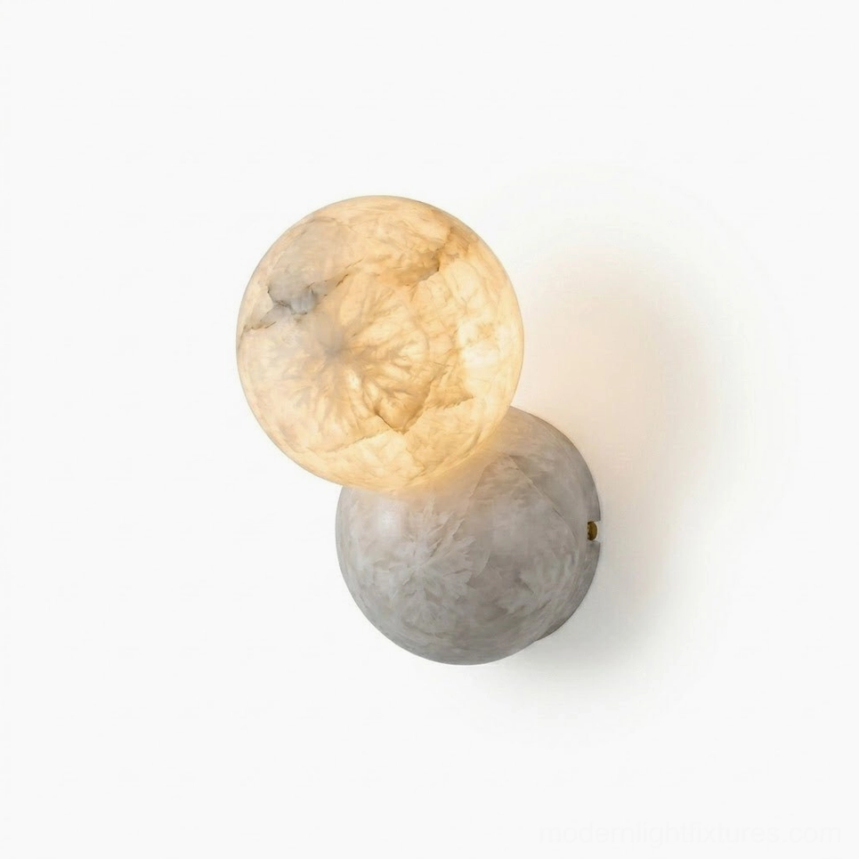 Orb Alabaster Wall Sconce low-angle frontal view in studio, double marbled stone spheres with glowing warm alabaster upper shade