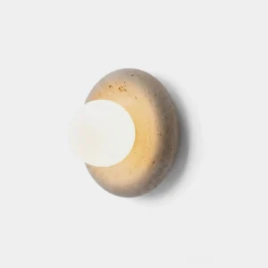 Orb wall sconce with yellow travertine disc and white frosted glass globe, front-facing product view on white background