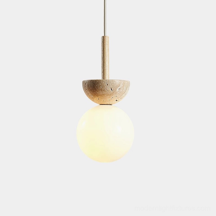 Orbis travertine globe pendant light close-up studio view, frosted glass sphere with stone fixture