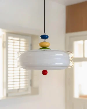 Orbit modern pendant lamp three-quarter view residential interior with multicolor bead accents