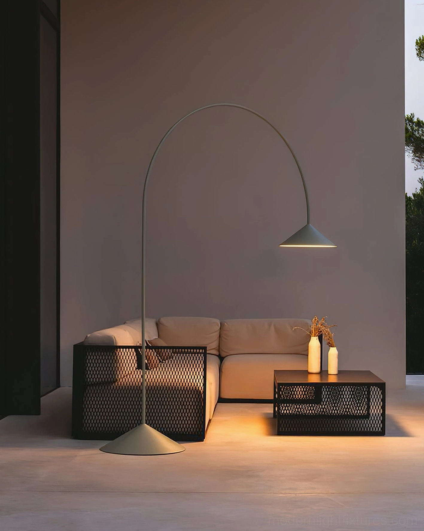 Orbitas arc floor lamp positioned in contemporary interior corner accent placement with LED ambient lighting