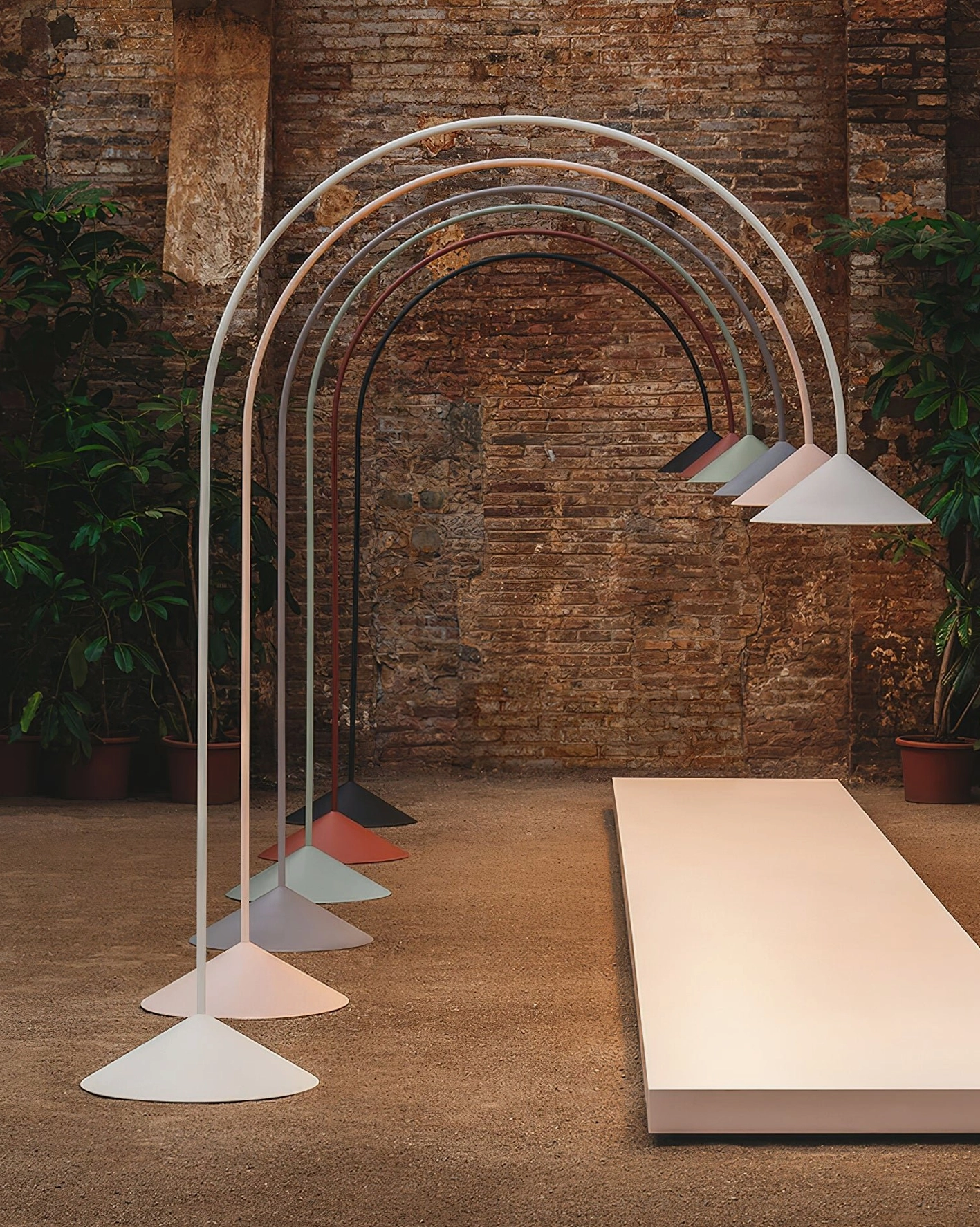 Orbitas minimalist arc floor lamp closeup detail view of matte aluminum pole and conical lamphead construction