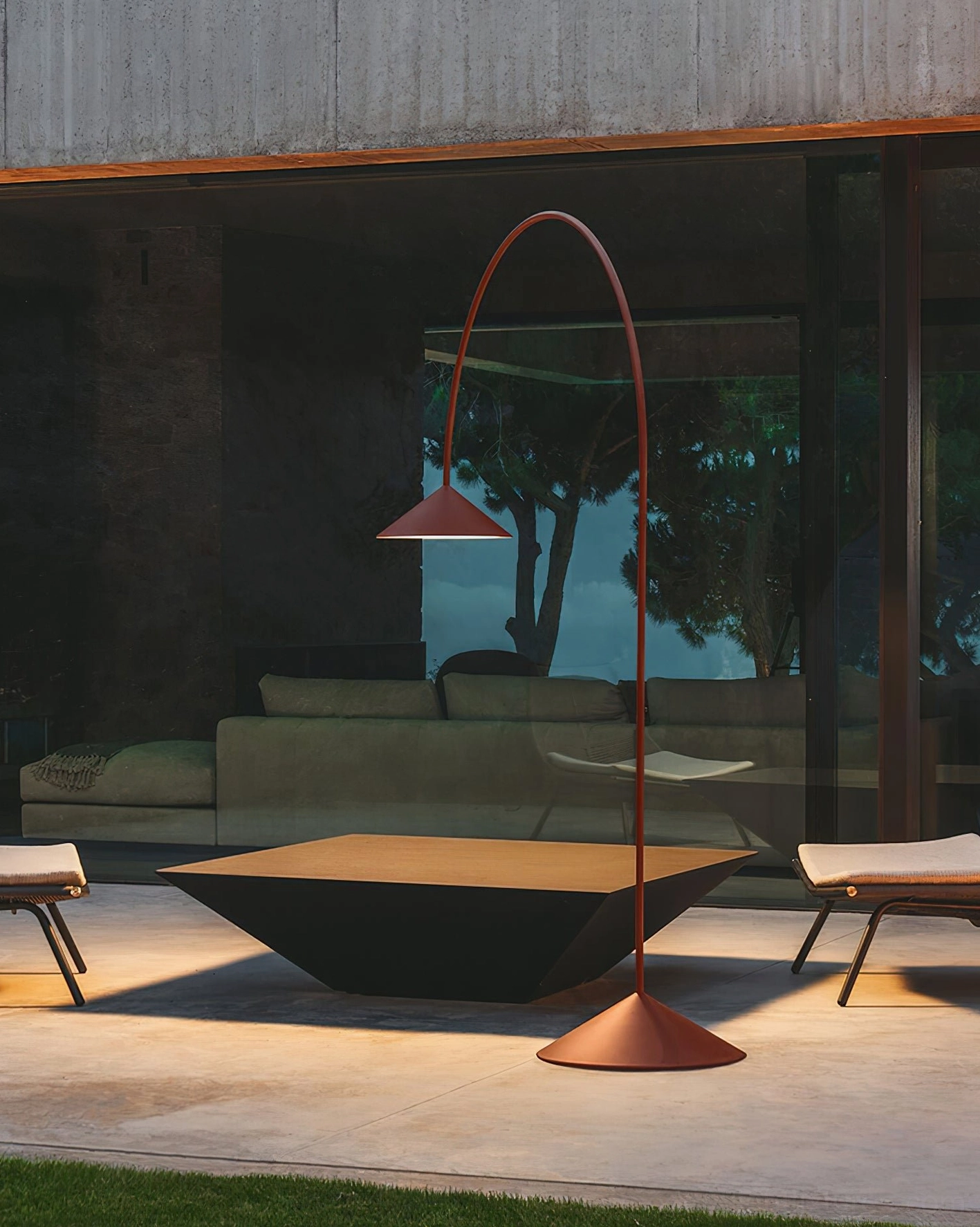 Terracotta Orbitas arc floor lamp exterior side view in contemporary outdoor patio living space