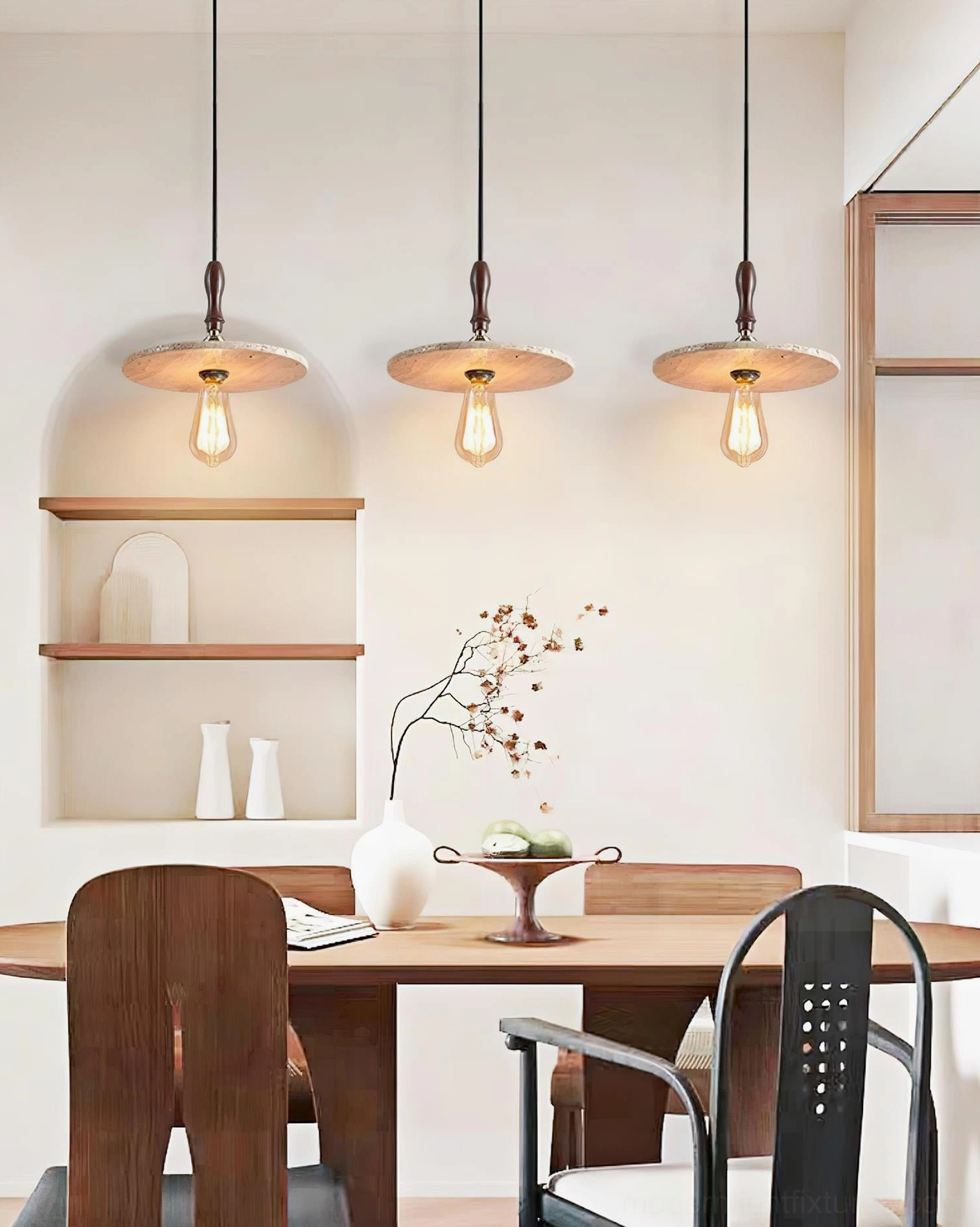 Multiple Orbiton natural stone pendant lights installed over dining table minimalist rustic dining room