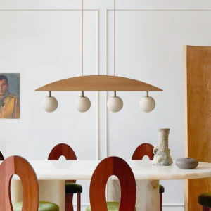 Orbline wooden chandelier installed in modern white dining room, showing natural wood finish with dual hanging cords
