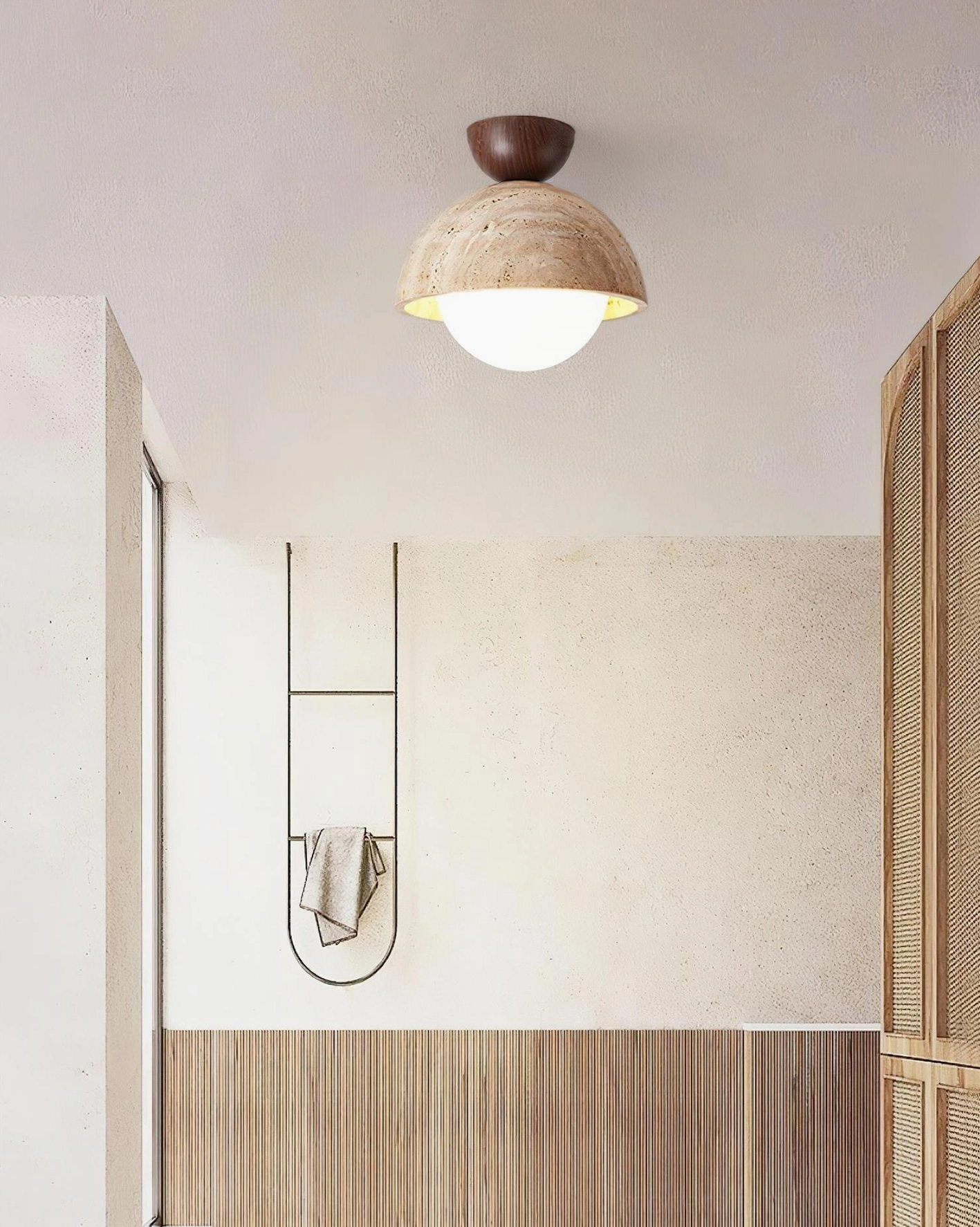 Orella travertine semi-flush ceiling lamp installed in bathroom with dark wood ceiling and rustic dome shade