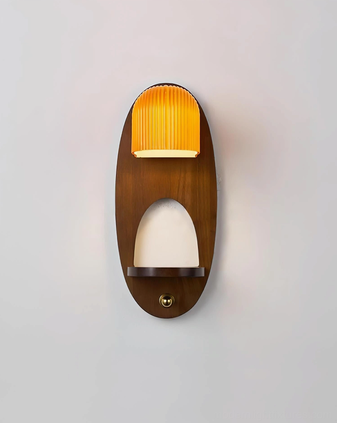 Orenso minimalist wall sconce close-up with lit ribbed amber shade and dark walnut stained wood backplate