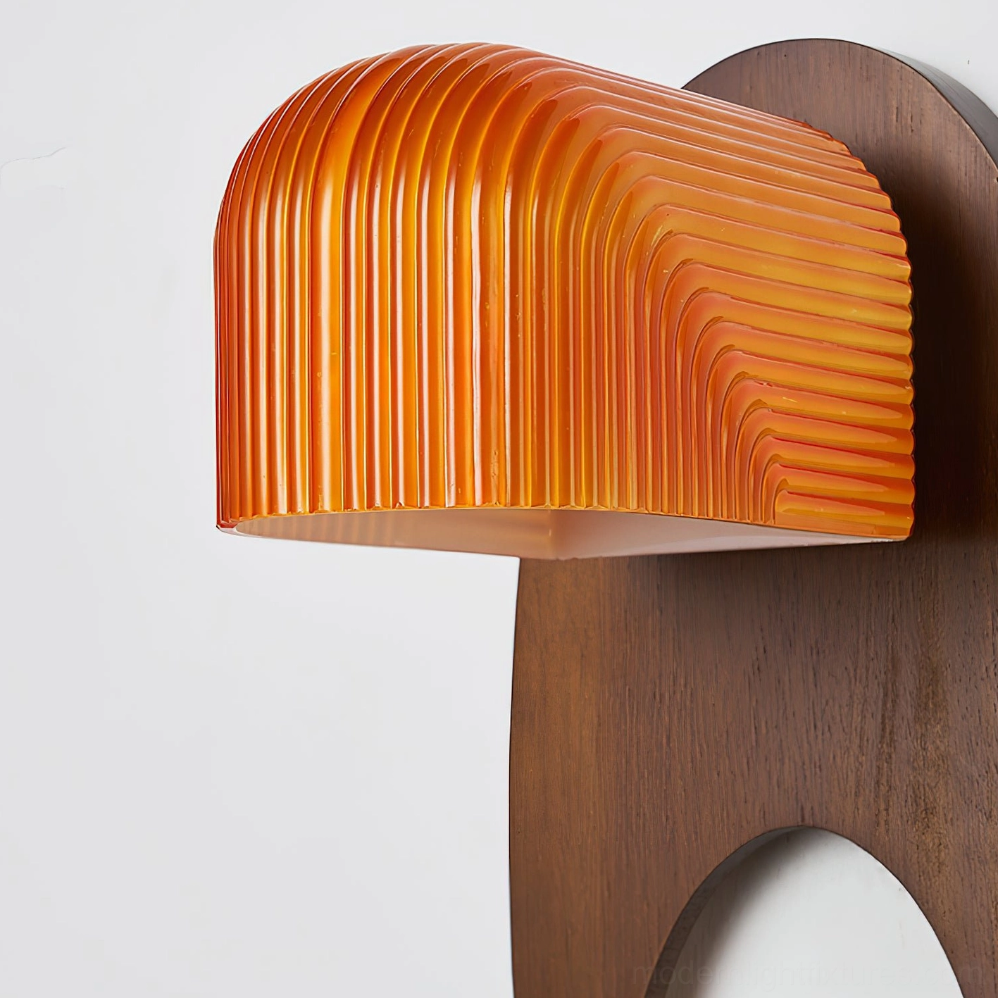 Orenso wall sconce direct front view showcasing walnut wood construction and orange ribbed amber glass design