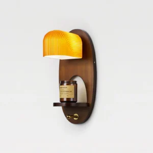 Orenso wooden wall sconce with integrated display shelf showing decorative scented candle and warm ambient lighting