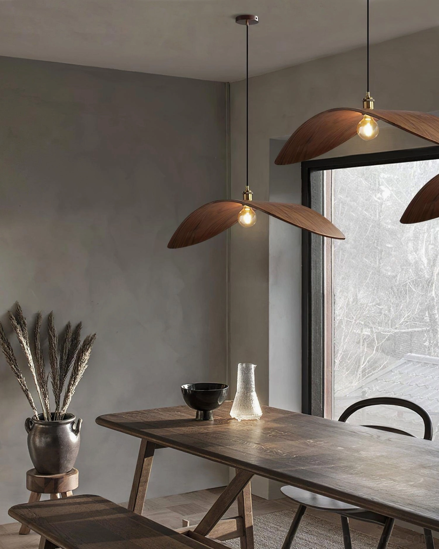Close-up of walnut leaf pendant lamp's organic leaf-shaped form emphasizing natural wood grain and sculptural design