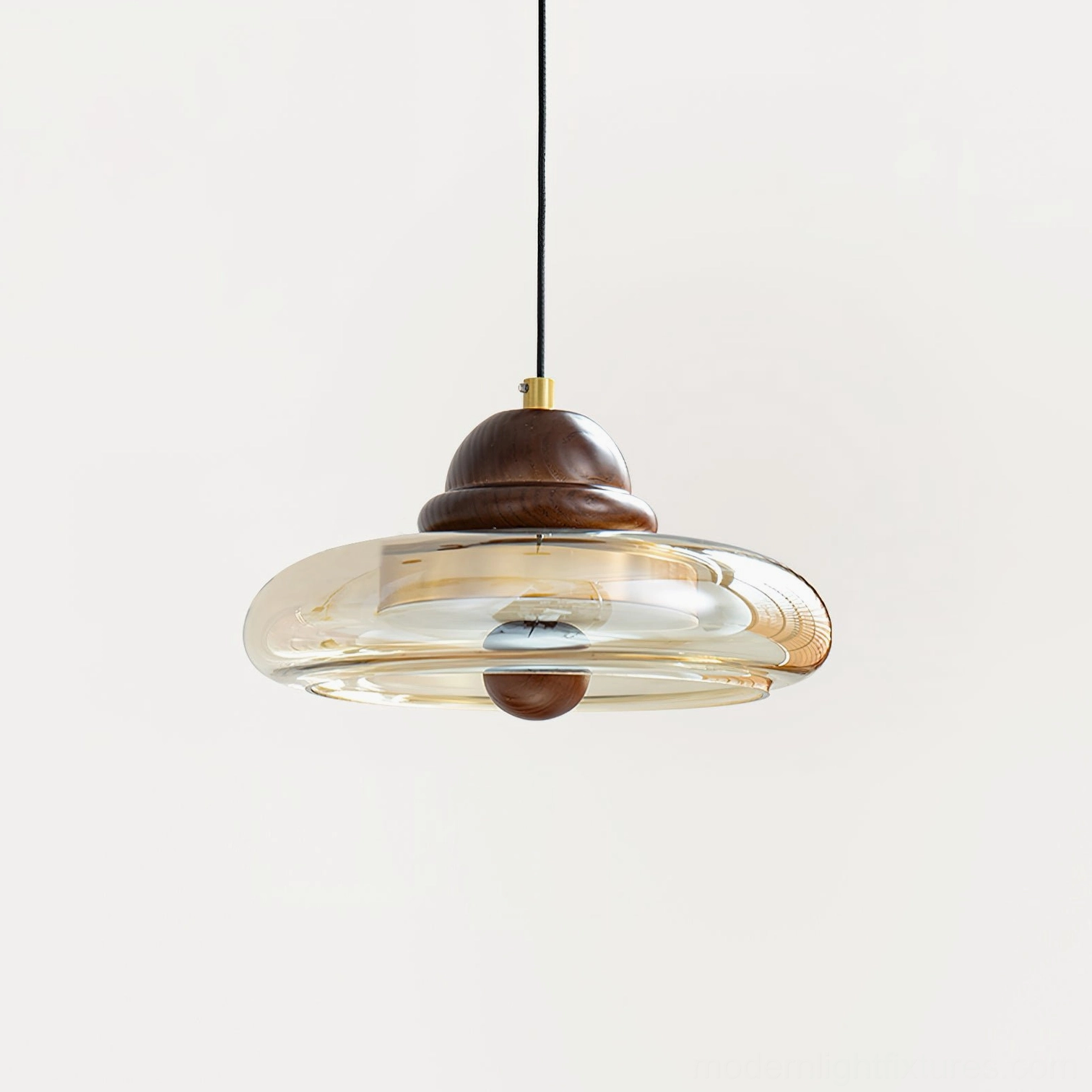Oria pendant light close-up showing internal LED socket with smoked amber glass cognac tint