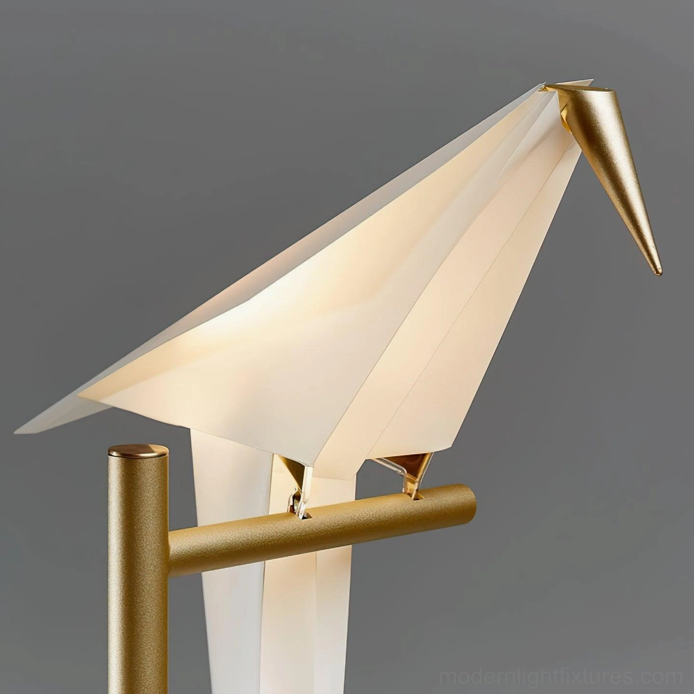 Origami crane LED table lamp with integrated warm white light source and brass metal construction