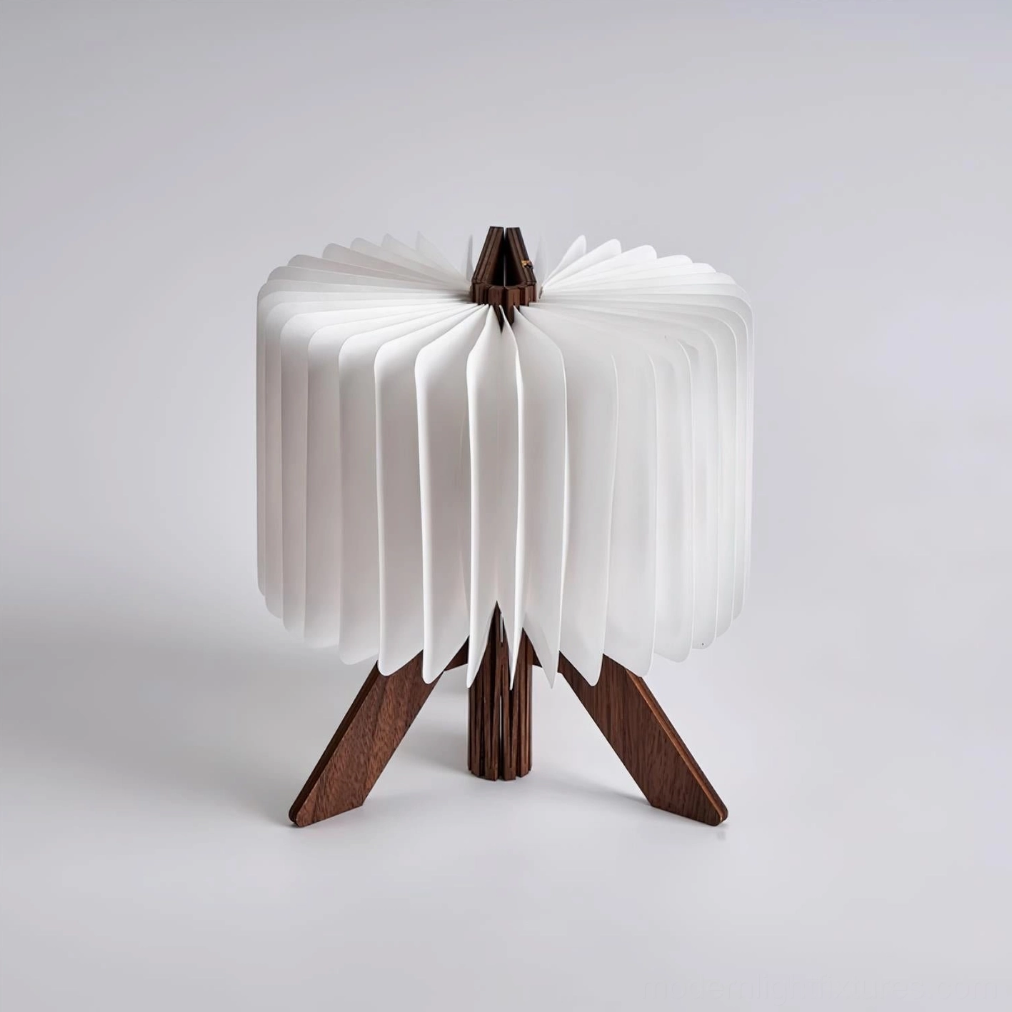 Compact and portable origami foldable desk lamp demonstrating space-saving design convenience