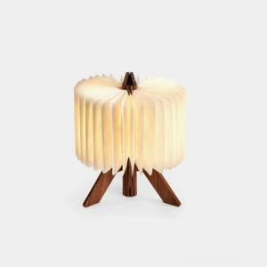 Origami wood foldable table lamp with warm white LED light on white studio background, minimalist geometric design