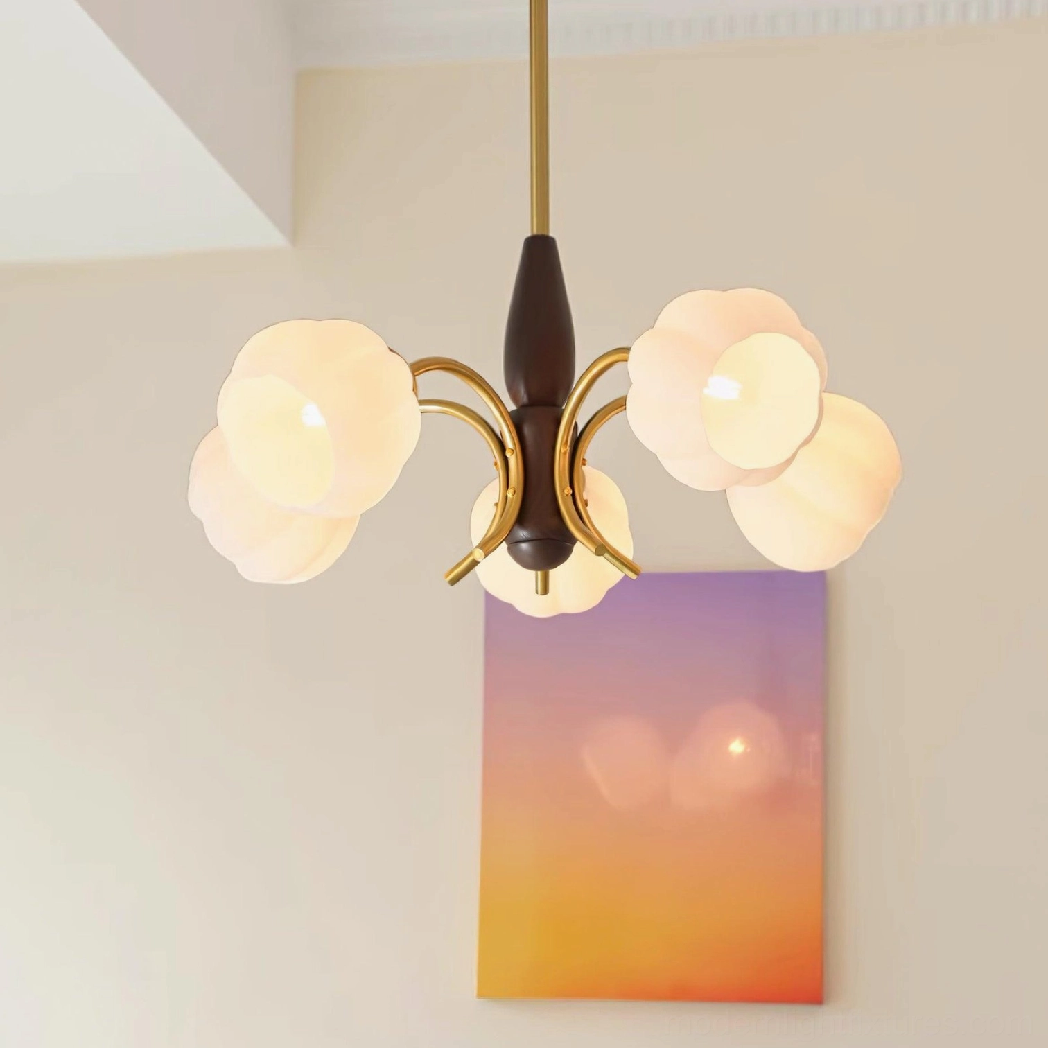 Illuminated Orillia chandelier with soft ambient warm light diffusing through frosted glass petals