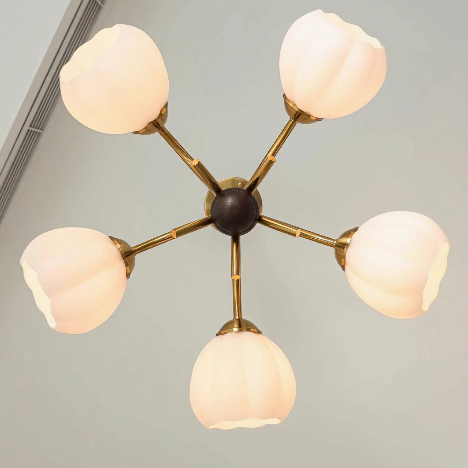 Vintage Orillia chandelier showing dark wood central column contrast with warm copper metalwork