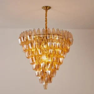 Orinelle amber crystal chandelier installed in luxury residential interior, warm ambient lighting in modern home