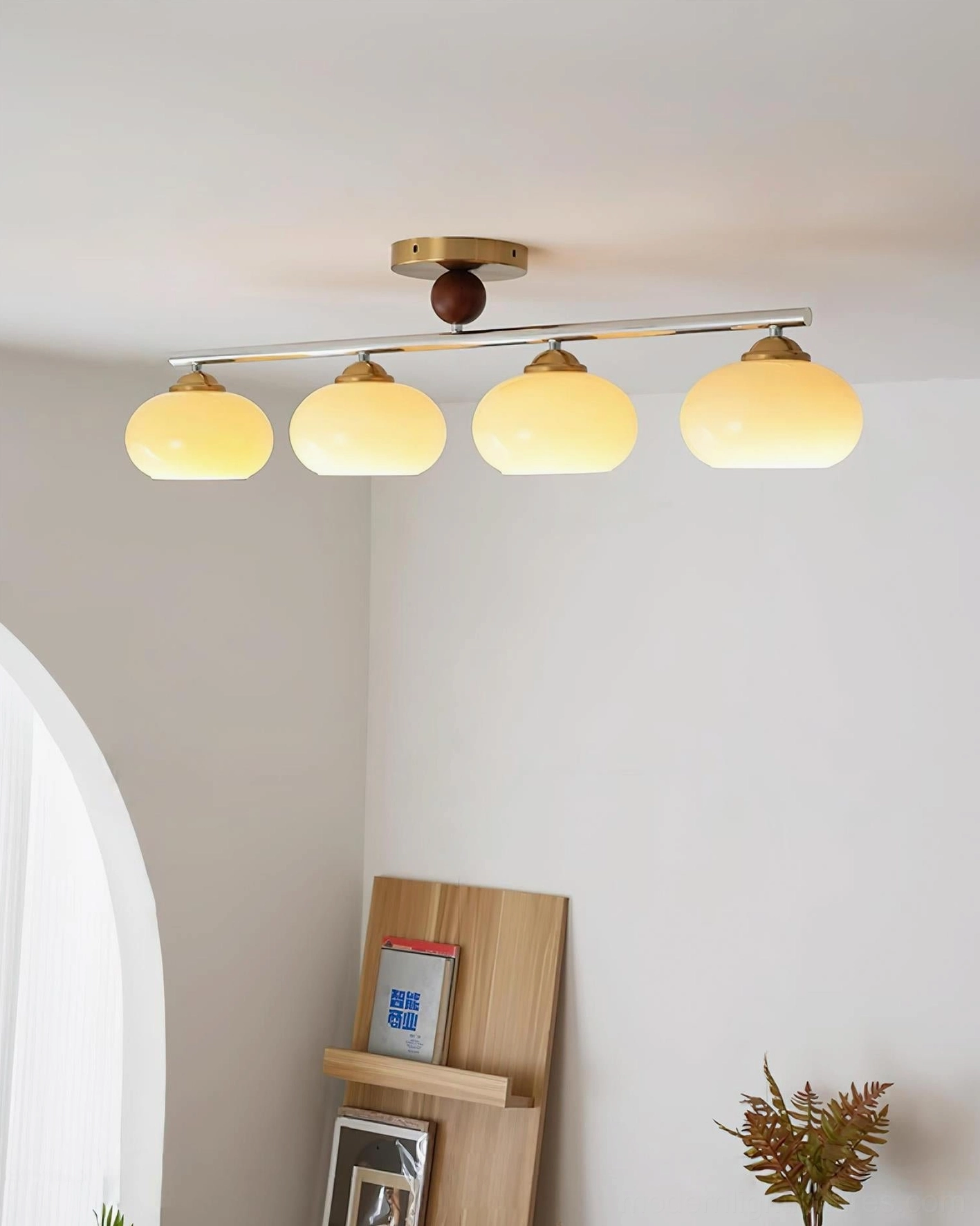 Orley 4-light ceiling fixture installed above residential dining table with warm ambient lighting
